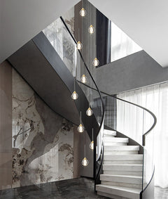 Lifestyle image of the 28-light chandelier in a luxurious entryway, showcasing its radiant crystal design.