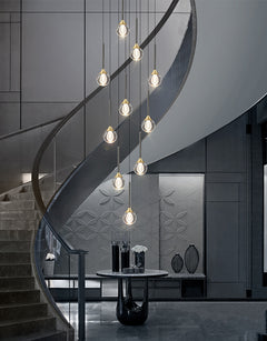 Lifestyle image of the 28-light chandelier in a luxurious entryway, showcasing its radiant crystal design.