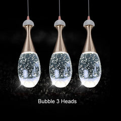 clear glass pendant light over dinning table